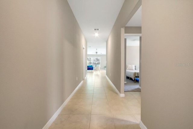 13419 Willow Bluestar Loop, Riverview, FL 33579 - hallway featuring baseboards and light tile patterned flooring