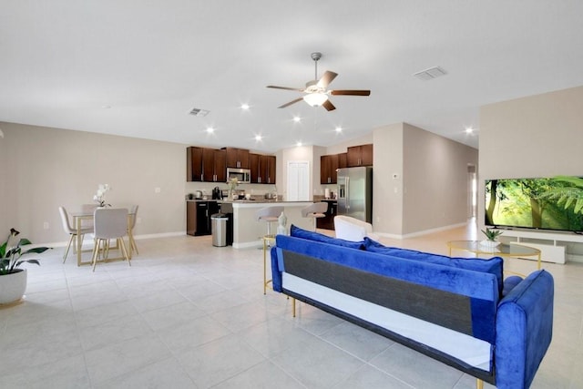 13419 Willow Bluestar Loop, Riverview, FL 33579 - living room featuring a ceiling fan, baseboards, visible vents, and vaulted ceiling