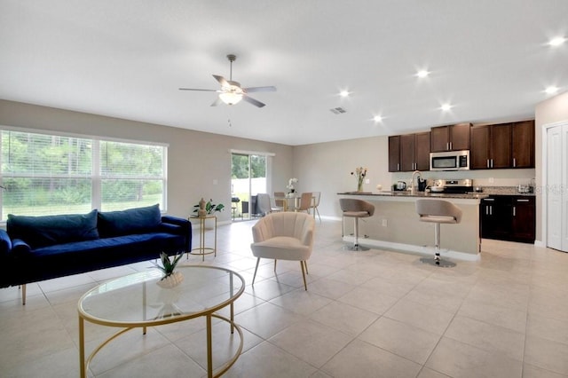 13419 Willow Bluestar Loop, Riverview, FL 33579 - living room featuring ceiling fan, recessed lighting, baseboards, light tile patterned floors, and visible vents