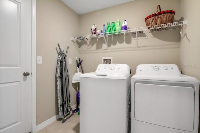 13419 Willow Bluestar Loop, Riverview, FL 33579 - laundry area featuring laundry area, baseboards, light carpet, and washing machine and clothes dryer