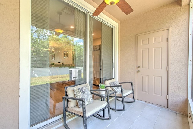 exterior space featuring ceiling fan