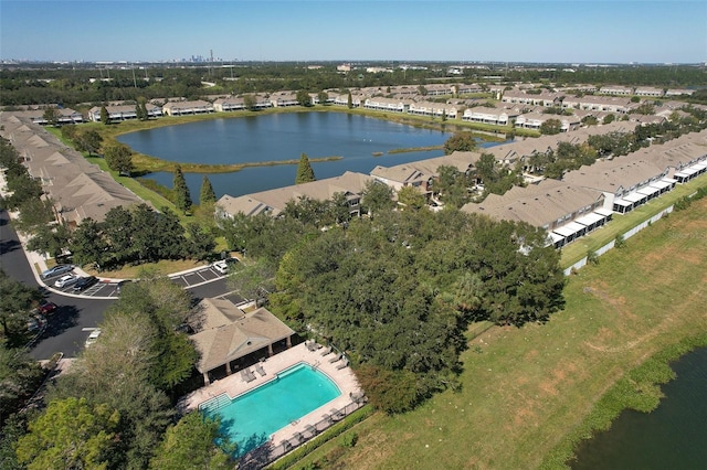 drone / aerial view with a residential view and a water view