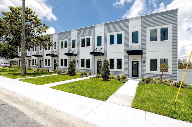 3402 E 28th Ave Unit 6, Tampa, FL 33605 - view of property with a front lawn and stucco siding