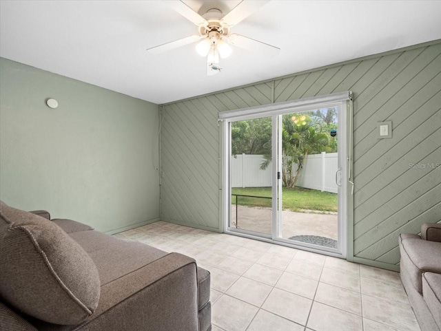 619 2nd St Unit 3, Indian Rocks Beach, FL 33785 - living room featuring a ceiling fan and light tile patterned floors
