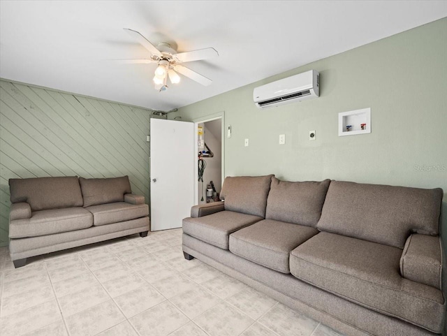 619 2nd St Unit 3, Indian Rocks Beach, FL 33785 - living area with a wall unit AC, a ceiling fan, and light tile patterned flooring