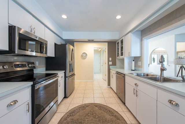 kitchen with light countertops, a sink, and appliances with stainless steel finishes