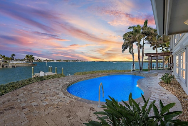 892 Harbor Is, Clearwater Beach, FL 33767 - pool at dusk with a boat dock, a water view, and a pool with connected hot tub