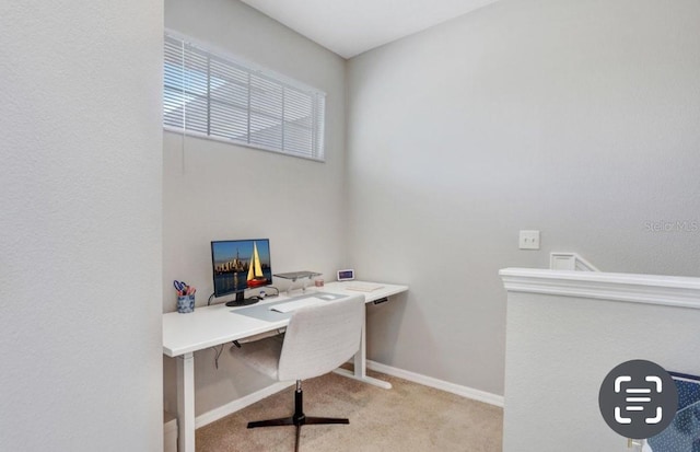 office space with carpet and baseboards