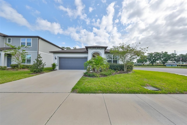 36959 Highland Meadows Ct, Zephyrhills, FL 33542 - view of front of house with stucco siding, an attached garage, a front lawn, and driveway