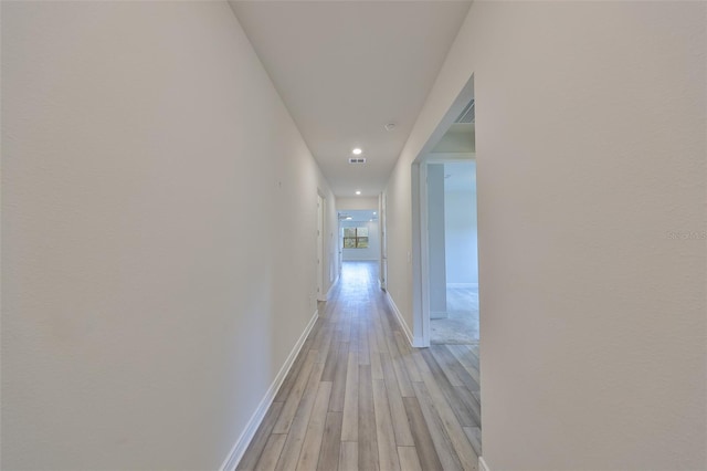 36959 Highland Meadows Ct, Zephyrhills, FL 33542 - hallway with light wood finished floors, baseboards, and recessed lighting