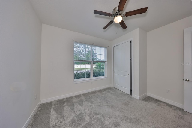 36959 Highland Meadows Ct, Zephyrhills, FL 33542 - unfurnished bedroom with carpet flooring, baseboards, a closet, and a ceiling fan