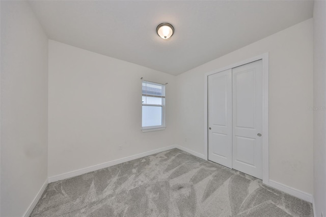 36959 Highland Meadows Ct, Zephyrhills, FL 33542 - unfurnished bedroom with carpet flooring, baseboards, and a closet