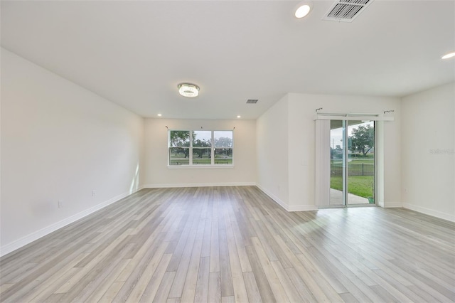 36959 Highland Meadows Ct, Zephyrhills, FL 33542 - unfurnished room with healthy amount of natural light, light wood finished floors, recessed lighting, and baseboards