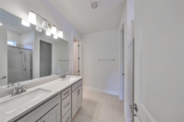 36959 Highland Meadows Ct, Zephyrhills, FL 33542 - bathroom featuring a shower stall, double vanity, tile patterned flooring, and baseboards