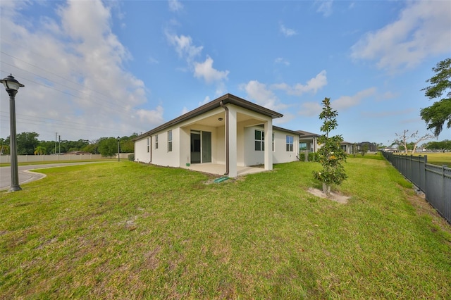 36959 Highland Meadows Ct, Zephyrhills, FL 33542 - rear view of property with a patio area and stucco siding