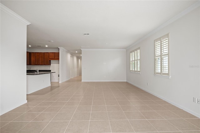 2477 Water Willow Dr, Lutz, FL 33558 - unfurnished living room featuring a sink, light tile patterned flooring, ornamental molding, visible vents, and recessed lighting