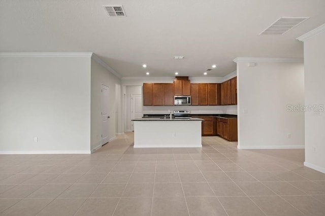 2477 Water Willow Dr, Lutz, FL 33558 - kitchen with dark countertops, visible vents, ornamental molding, appliances with stainless steel finishes, and open floor plan