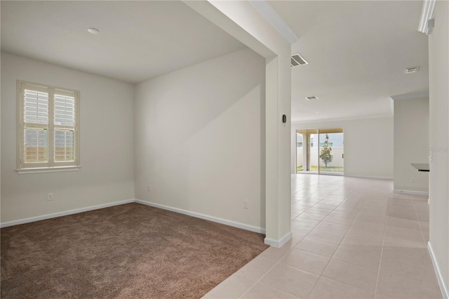 2477 Water Willow Dr, Lutz, FL 33558 - empty room featuring visible vents, baseboards, light carpet, and light tile patterned floors