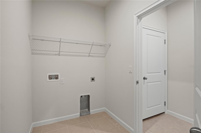 2477 Water Willow Dr, Lutz, FL 33558 - washroom with baseboards, hookup for a washing machine, electric dryer hookup, laundry area, and light tile patterned floors