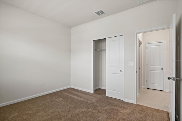 2477 Water Willow Dr, Lutz, FL 33558 - unfurnished bedroom featuring visible vents, light carpet, baseboards, and a closet