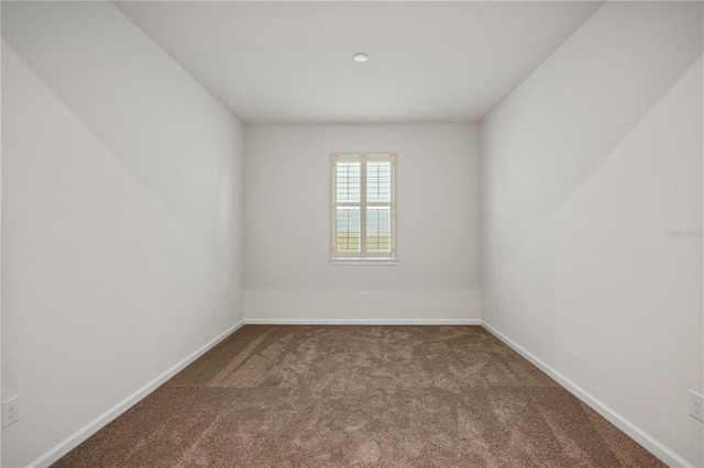 2477 Water Willow Dr, Lutz, FL 33558 - spare room featuring baseboards and carpet