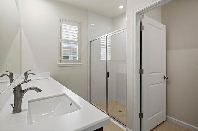 2477 Water Willow Dr, Lutz, FL 33558 - bathroom featuring tile patterned floors, a sink, double vanity, and a stall shower