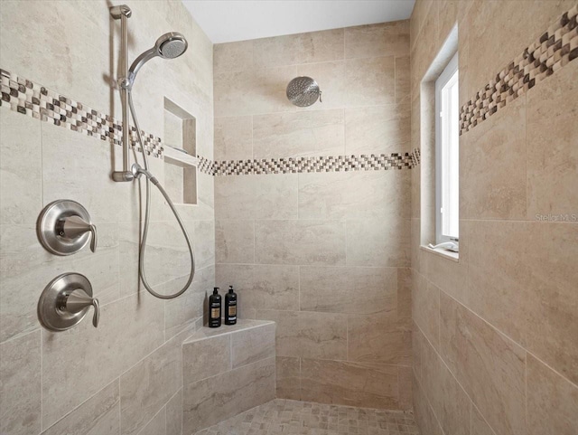 bathroom featuring tiled shower