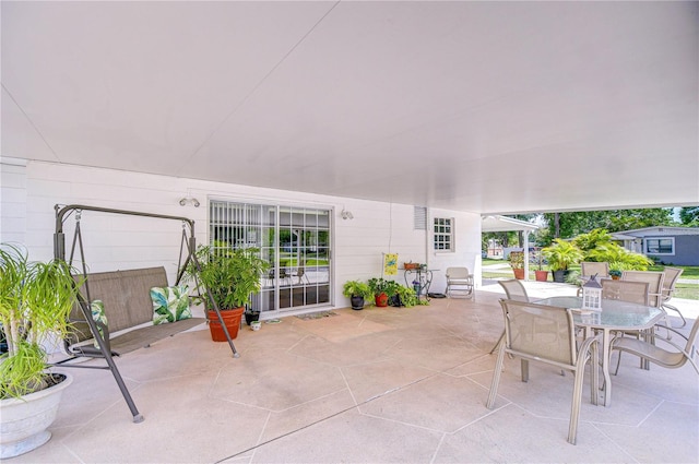 view of patio featuring outdoor dining area