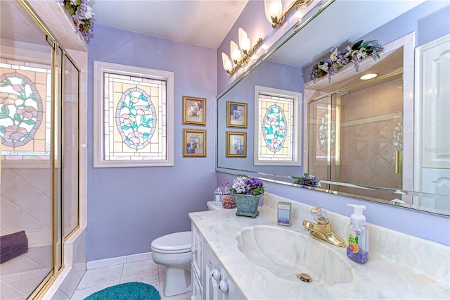full bathroom featuring tile patterned floors, a shower stall, toilet, and vanity