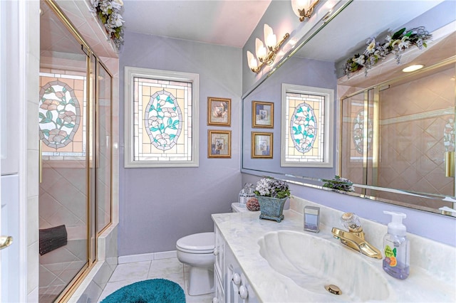 full bath with toilet, tile patterned flooring, a shower stall, and vanity