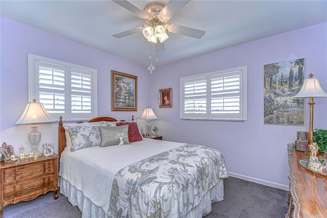 bedroom with a ceiling fan, carpet, and baseboards