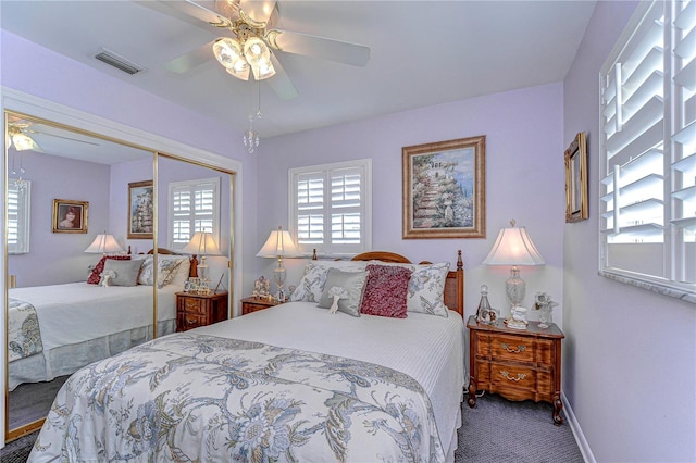 bedroom featuring carpet floors, a closet, ceiling fan, baseboards, and visible vents