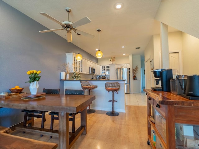 dining area featuring visible vents, baseboards, light wood-type flooring, recessed lighting, and a ceiling fan