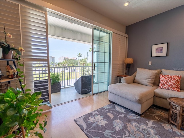 living room featuring recessed lighting, wood finished floors, and a wealth of natural light