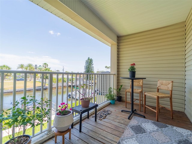 balcony featuring a water view