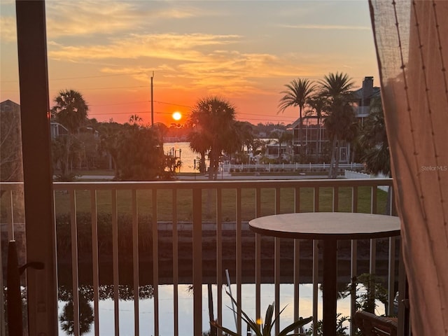 view of balcony at dusk