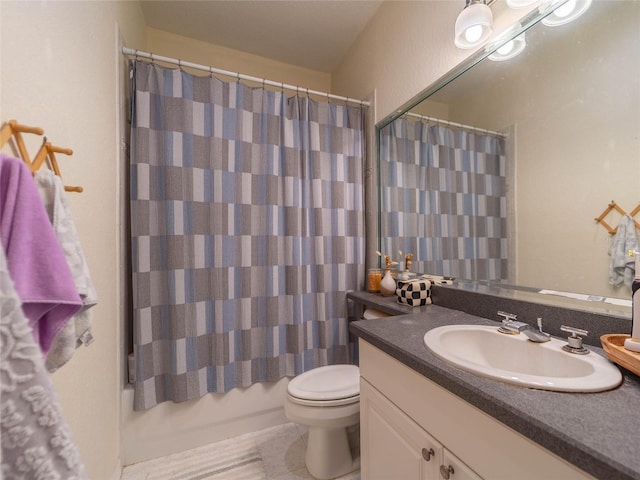 full bath with tile patterned floors, toilet, and vanity