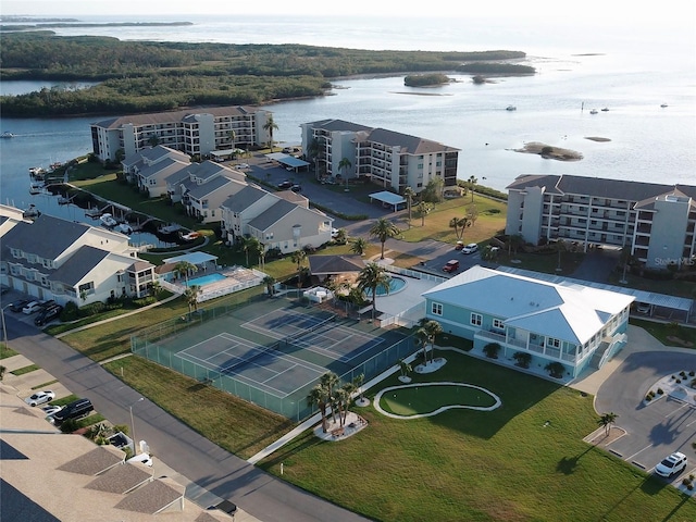 birds eye view of property with a water view