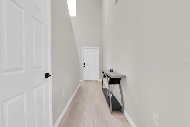7721 Twin Leaf Ter, Parrish, FL 34219 - hallway with baseboards and light wood-style flooring