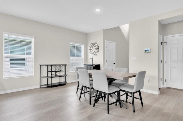 7721 Twin Leaf Ter, Parrish, FL 34219 - dining room with baseboards, recessed lighting, and light wood-style flooring
