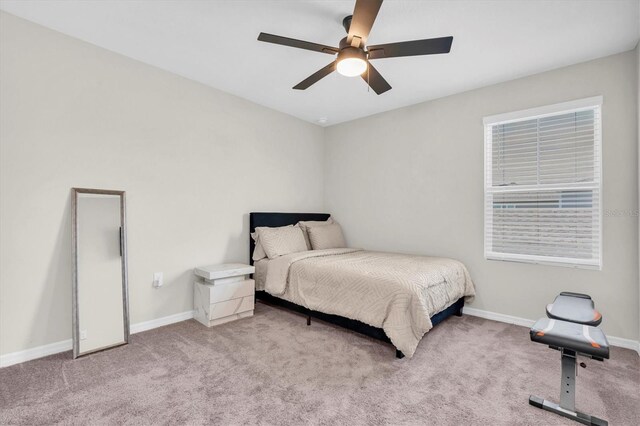 7721 Twin Leaf Ter, Parrish, FL 34219 - carpeted bedroom featuring baseboards and ceiling fan