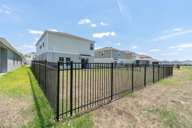 7721 Twin Leaf Ter, Parrish, FL 34219 - rear view of house featuring a residential view, a lawn, and fence private yard