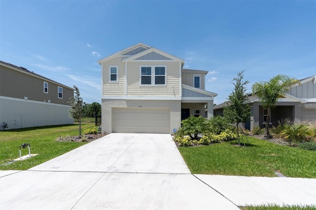 7721 Twin Leaf Ter, Parrish, FL 34219 - view of front of home featuring board and batten siding, driveway, a front lawn, an attached garage, and stucco siding