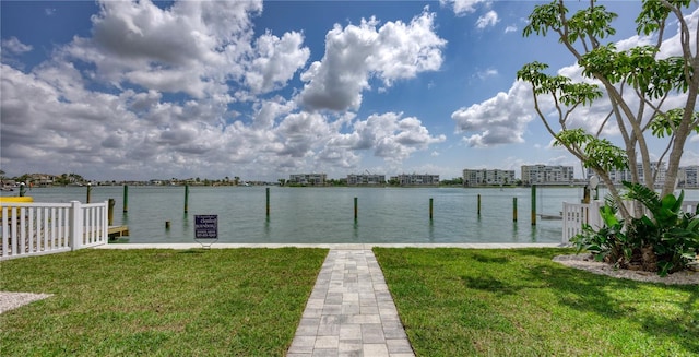 8635 Boca Ciega Dr, St Pete Beach, FL 33706 - dock area featuring a yard and a water view
