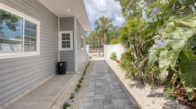 8635 Boca Ciega Dr, St Pete Beach, FL 33706 - view of side of property featuring fence