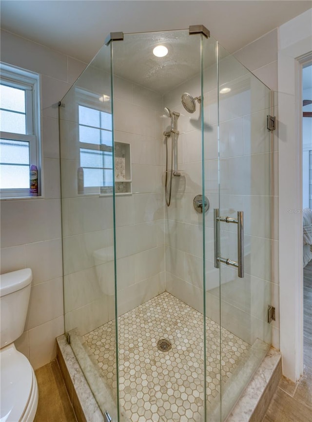 8635 Boca Ciega Dr, St Pete Beach, FL 33706 - full bathroom with a stall shower and toilet