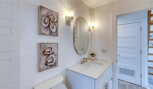 8635 Boca Ciega Dr, St Pete Beach, FL 33706 - half bath with visible vents, toilet, and vanity