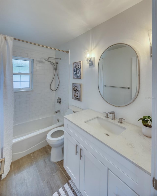 8635 Boca Ciega Dr, St Pete Beach, FL 33706 - full bathroom with shower / bath combo with shower curtain, toilet, wood finished floors, and vanity