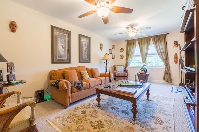 living area with carpet floors, a ceiling fan, and baseboards