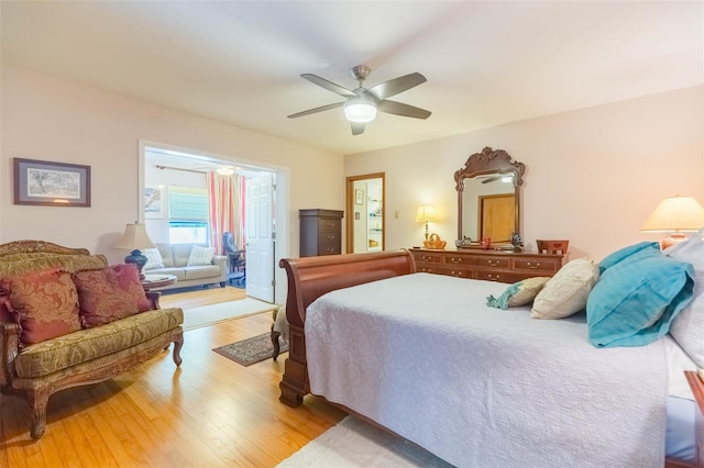 bedroom featuring ceiling fan, access to exterior, and light wood-style flooring